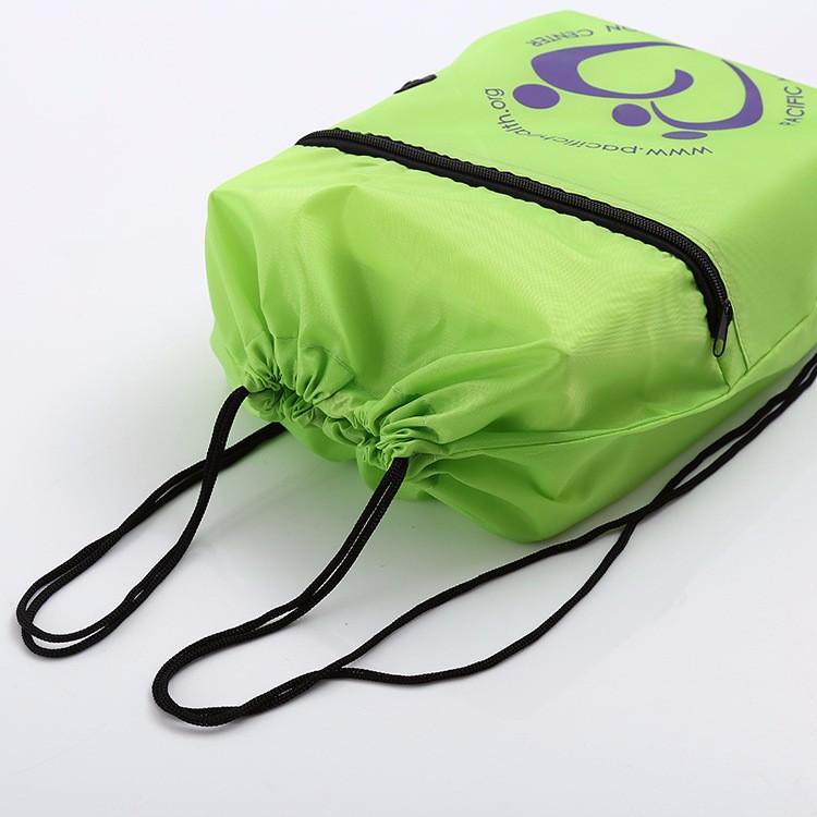 Nylon drawstring bag with front zipper pocket